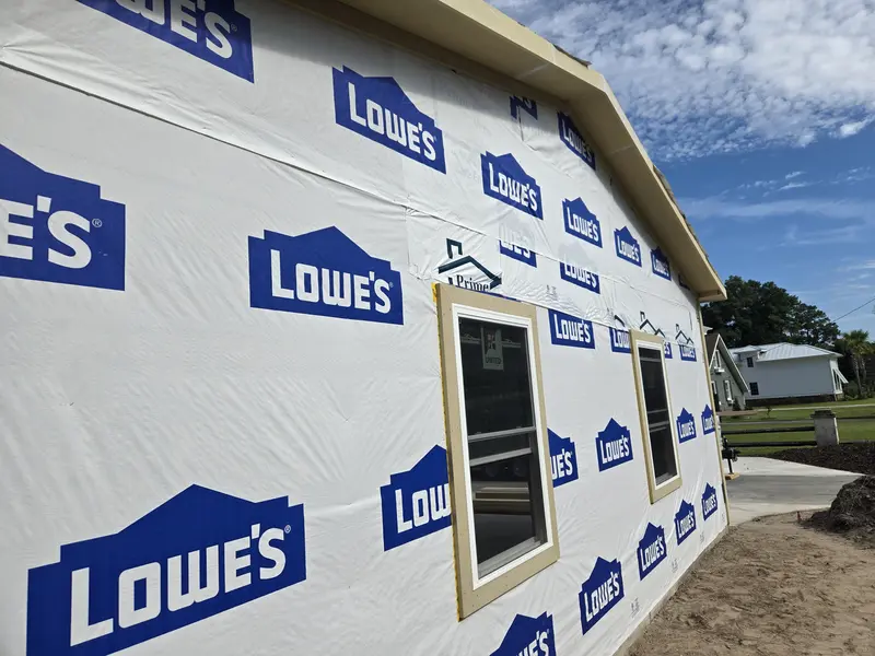 Garage gable end in house wrap with two new double-hung windows, Lake Waccamaw, NC