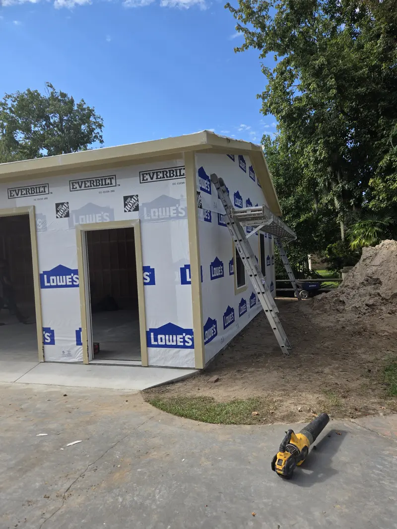 Detached garage sheathed and wrapped in house wrap with bay openings framed, Lake Waccamaw, NC