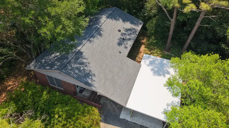 Overhead view of a new grey shingle roof and white flat carport roof, Wilmington, NC
