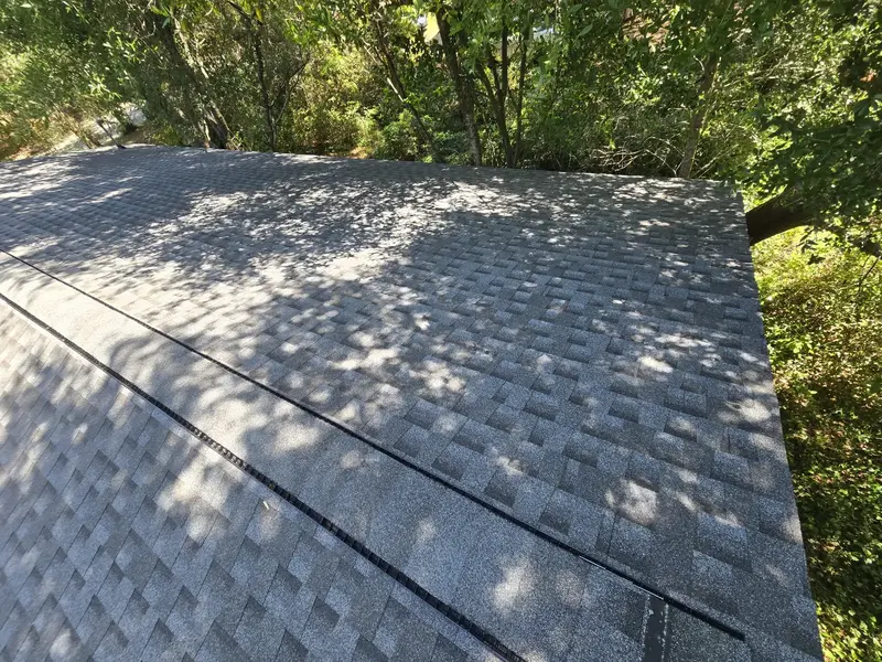 Ridge vent with shingle caps on a new grey shingle roof, Wilmington, NC
