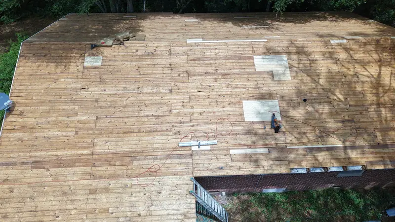 Roof stripped to the original plank deck with new plywood patches, Wilmington, NC