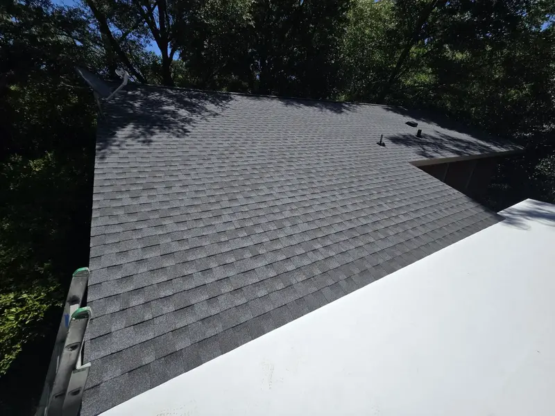 New grey architectural shingle slope above a white flat carport roof, Wilmington, NC